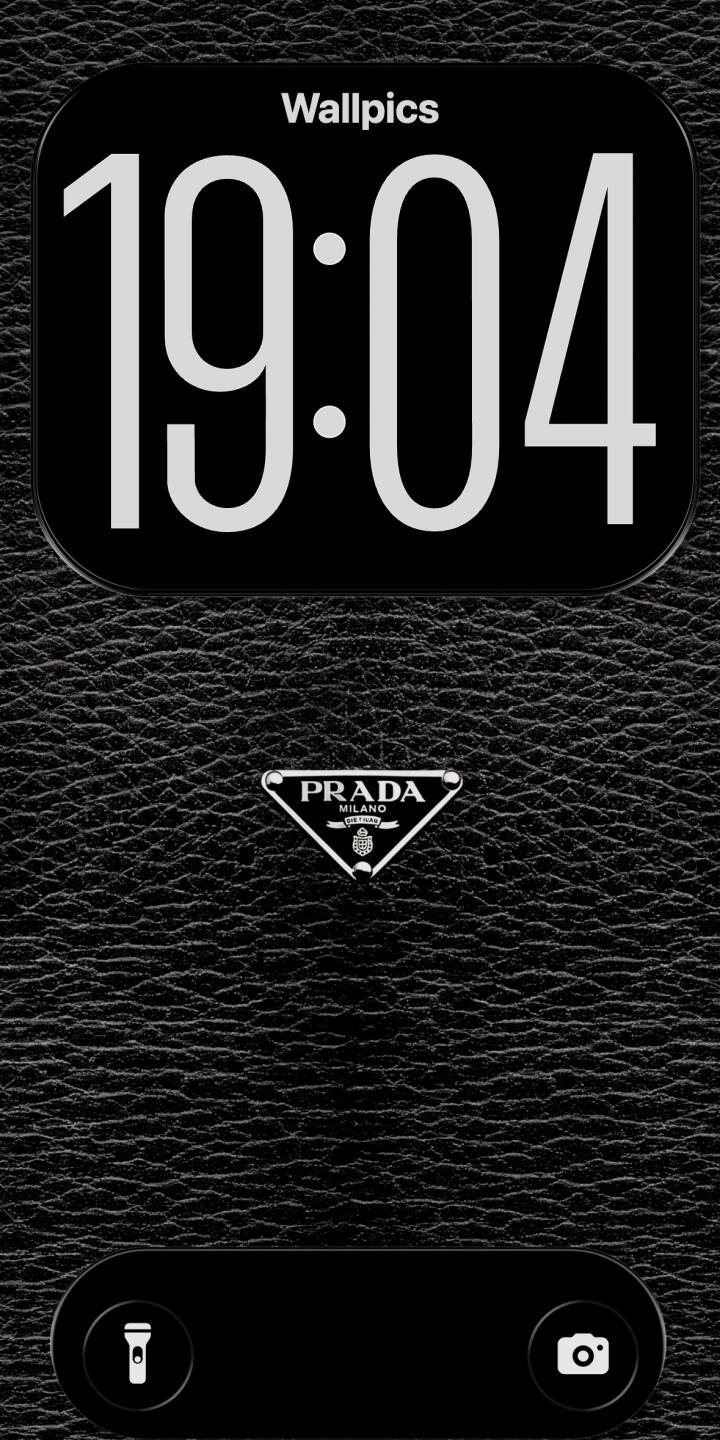 The rich, textured black faux leather background stylishly frames the iconic white Prada logo in this elegant 4K wallpaper, making it a sophisticated wallpaper choice for your iPhone. | black iphone luxury minimalist wallpaper leather prada texture mobile 4k wallpaper hd wallpaper designer The rich, textured black faux leather background stylishly frames the iconic white Prada logo in this elegant 4K wallpaper, making it a sophisticated wallpaper choice for your iPhone.