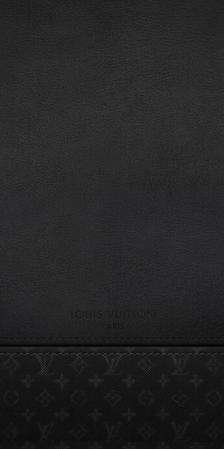 Subtle embossed Louis Vuitton branding graces a sleek combination of dark leather texture and signature monogram patterns in this sophisticated 4K wallpaper. It makes a luxurious background wallpaper for iPhone. | aesthetic dark iphone lv wallpaper leather louis vuitton mobile 4k wallpaper hd wallpaper designer monogram Subtle embossed Louis Vuitton branding graces a sleek combination of dark leather texture and signature monogram patterns in this sophisticated 4K wallpaper. It makes a luxurious background wallpaper for iPhone.