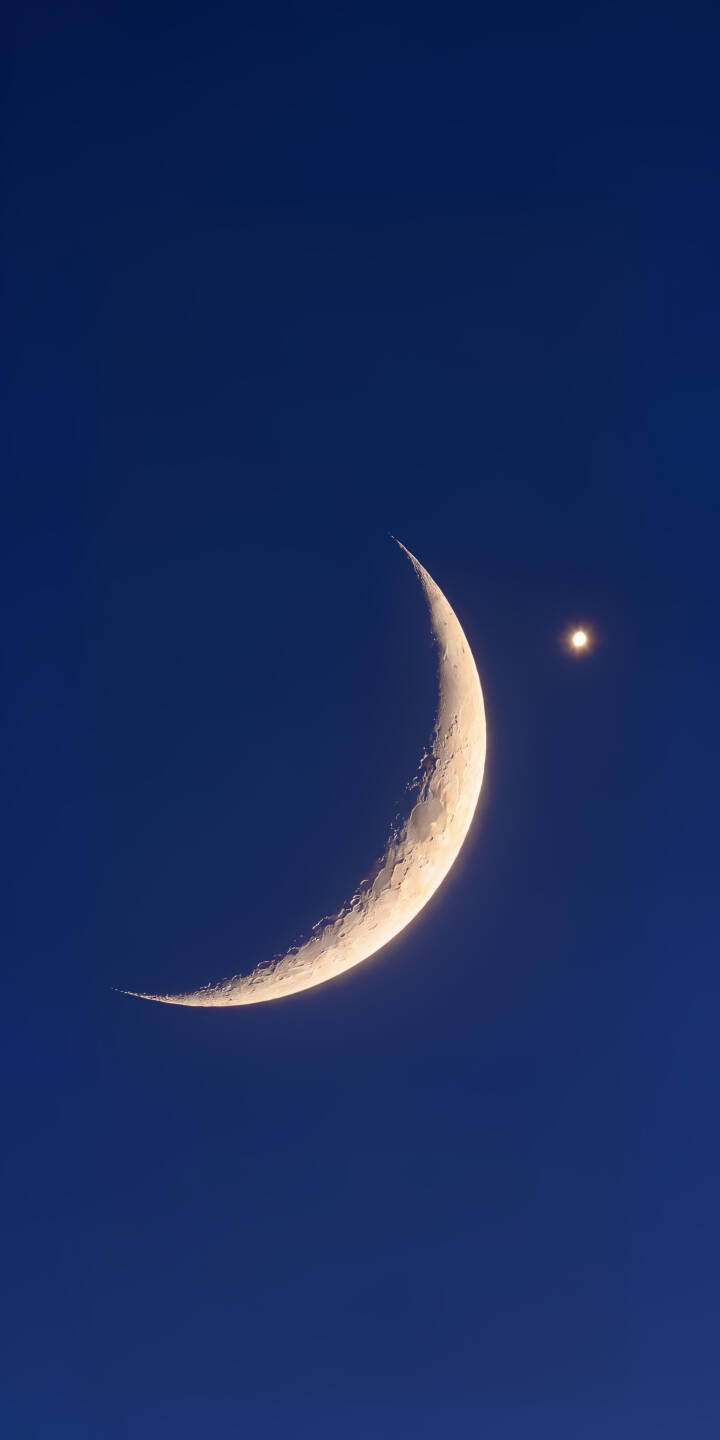 A slender, illuminated crescent moon glows against the deep blue twilight sky, accompanied by a single bright star in this captivating 4K wallpaper. This serene celestial scene makes an ideal wallpaper for iPhone screens. | star moon night sky crescent iphone wallpaper mobile 4k wallpaper hd wallpaper astronomy celestial A slender, illuminated crescent moon glows against the deep blue twilight sky, accompanied by a single bright star in this captivating 4K wallpaper. This serene celestial scene makes an ideal wallpaper for iPhone screens.