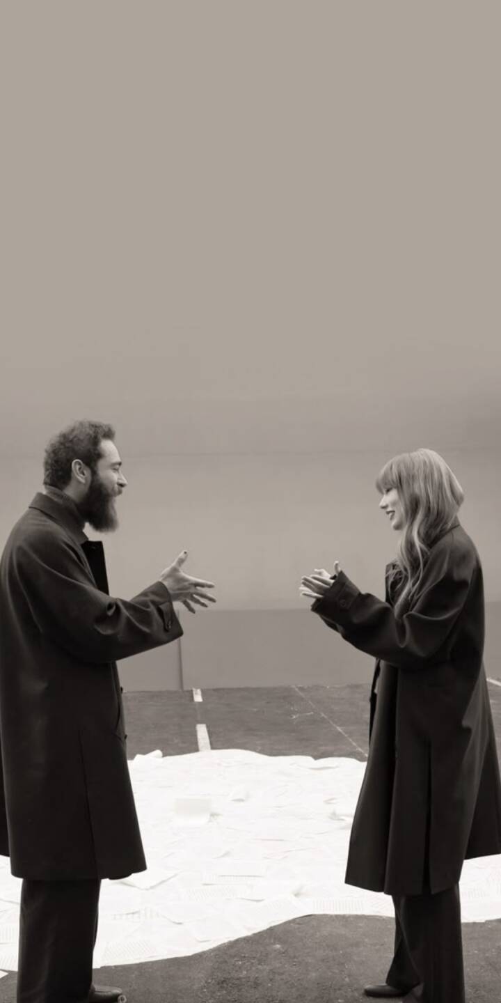 A shared smile lights up Taylor Swift's face as she interacts with Aaron Dessner in this striking black and white 4K wallpaper, a perfect aesthetic wallpaper for your iPhone lock screen. | artist A shared smile lights up Taylor Swift's face as she interacts with Aaron Dessner in this striking black and white 4K wallpaper, a perfect aesthetic wallpaper for your iPhone lock screen.