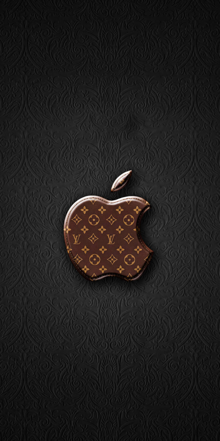 The iconic Louis Vuitton monogram pattern elevates the Apple logo against a subtly embossed dark background in this premium 4K wallpaper — a must-have wallpaper for iPhone users seeking a touch of luxury. | aesthetic apple iphone luxury lv wallpaper louis vuitton mobile 4k wallpaper hd wallpaper designer monogram The iconic Louis Vuitton monogram pattern elevates the Apple logo against a subtly embossed dark background in this premium 4K wallpaper — a must-have wallpaper for iPhone users seeking a touch of luxury.