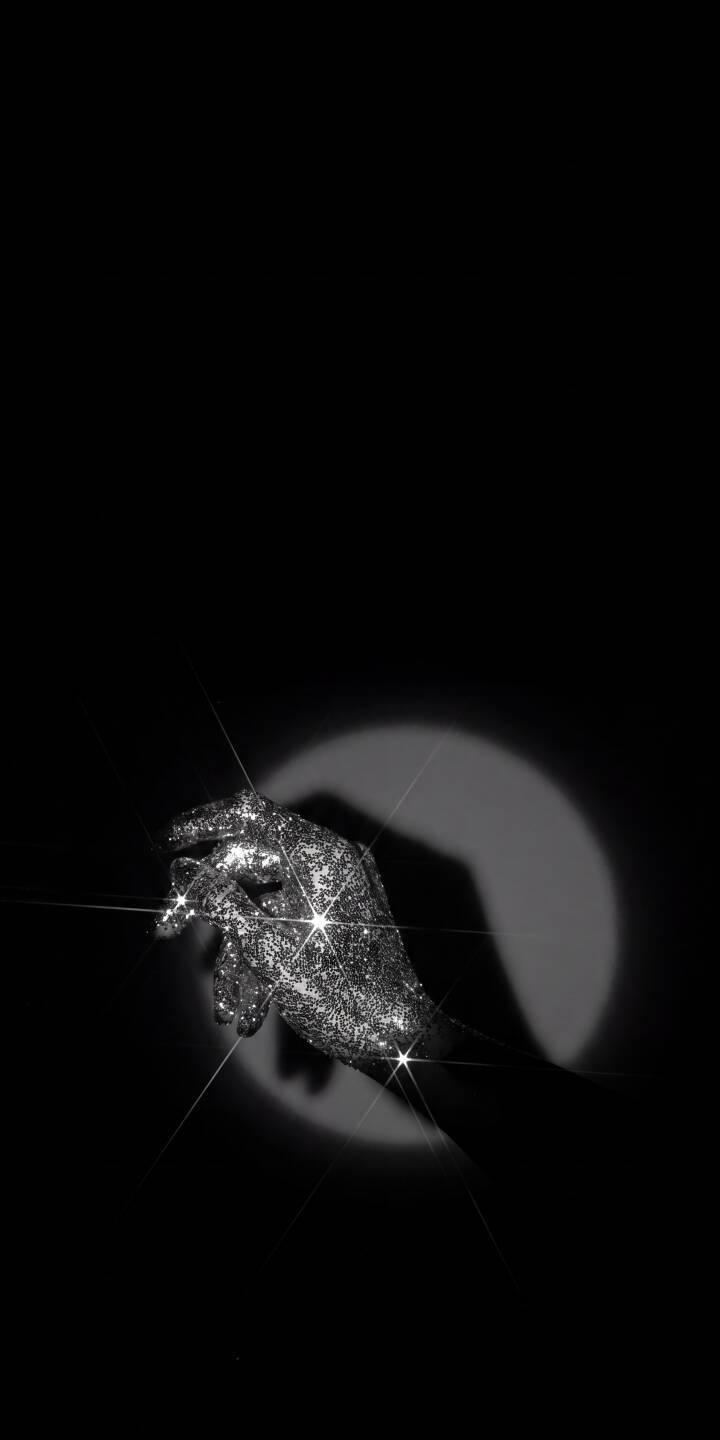 The dazzling glitter on a mysterious hand shimmers intensely under a stark spotlight in this elegant 4K wallpaper, creating a dramatic interplay of light and shadow—a captivating aesthetic wallpaper perfect for iPhone. | hand iphone wallpaper spotlight sparkling mobile 4k wallpaper hd wallpaper black wallpaper dark aesthetic mysterious glitter hand The dazzling glitter on a mysterious hand shimmers intensely under a stark spotlight in this elegant 4K wallpaper, creating a dramatic interplay of light and shadow—a captivating aesthetic wallpaper perfect for iPhone.
