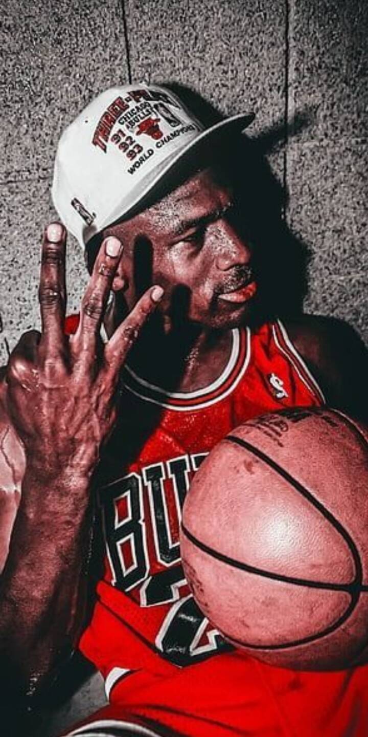 Drenched in sweat, Michael Jordan celebrates his 'Three-Peat' victory, wearing a white Bulls championship hat and holding up three fingers in this iconic 4K wallpaper. This powerful wallpaper for iPhone captures the legendary intensity of a basketball icon's triumph. | artist Drenched in sweat, Michael Jordan celebrates his 'Three-Peat' victory, wearing a white Bulls championship hat and holding up three fingers in this iconic 4K wallpaper. This powerful wallpaper for iPhone captures the legendary intensity of a basketball icon's triumph.