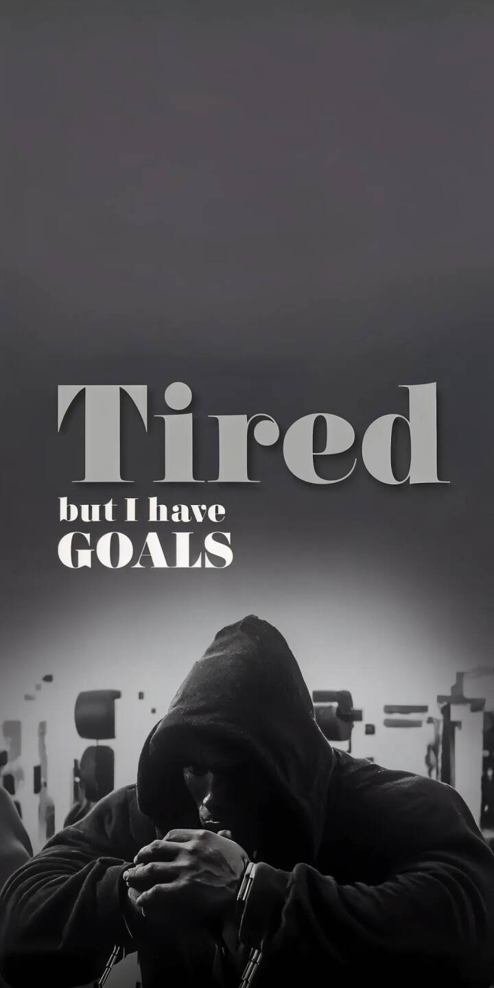The poignant message 'Tired but I have GOALS' is prominently displayed above a person in a darkened hoodie, head bowed in deep contemplation, making this a powerful 4K motivational wallpaper. This black and white aesthetic, featuring a gym background, creates an inspiring iPhone wallpaper for daily determination. | sort The poignant message 'Tired but I have GOALS' is prominently displayed above a person in a darkened hoodie, head bowed in deep contemplation, making this a powerful 4K motivational wallpaper. This black and white aesthetic, featuring a gym background, creates an inspiring iPhone wallpaper for daily determination.