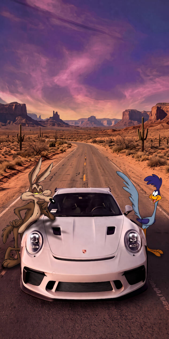 A surreal purple and pink sunset sky casts a dramatic glow over the vast desert landscape, where the iconic Wile E. Coyote and Road Runner playfully interact with a sleek white Porsche in this stunning 4K wallpaper. This captivating blend of classic animation and photorealism makes for an unforgettable iPhone wallpaper, perfect for fans of cartoons and luxury cars. | sunset desert iphone porsche wallpaper animation mobile 4k wallpaper hd wallpaper road runner looney tunes wile e coyote A surreal purple and pink sunset sky casts a dramatic glow over the vast desert landscape, where the iconic Wile E. Coyote and Road Runner playfully interact with a sleek white Porsche in this stunning 4K wallpaper. This captivating blend of classic animation and photorealism makes for an unforgettable iPhone wallpaper, perfect for fans of cartoons and luxury cars.
