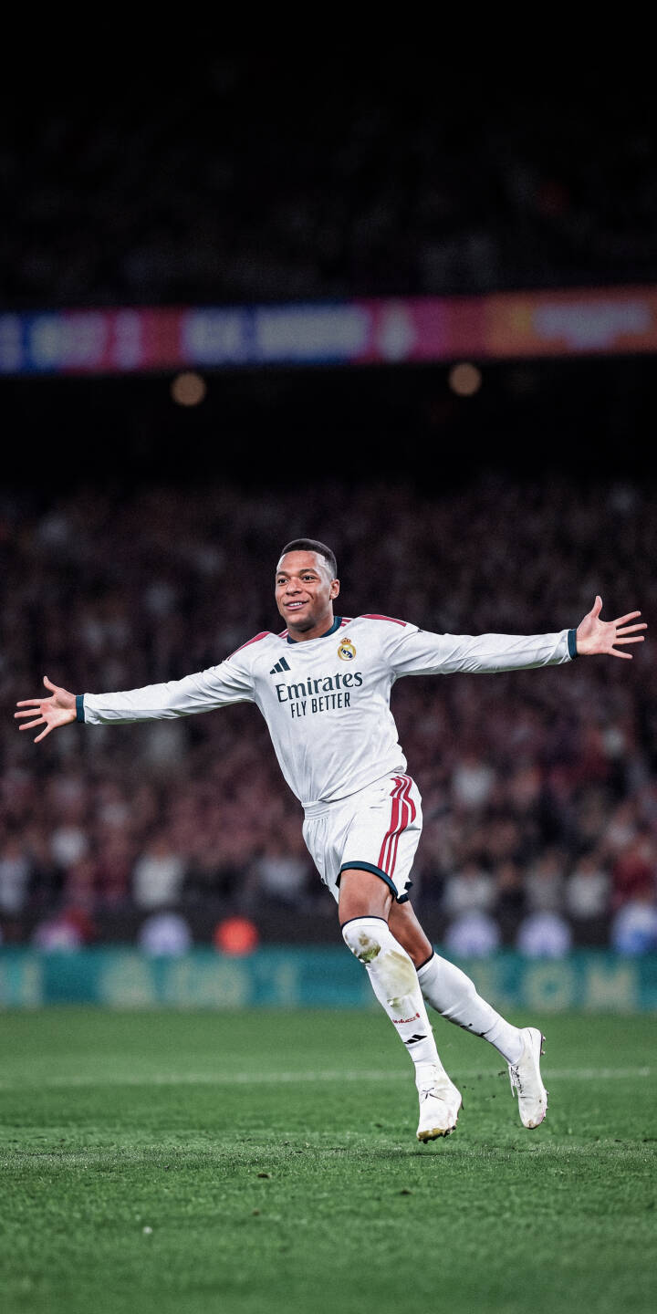 Rodrygo beams with pure joy, arms outstretched in a classic goal celebration pose on the vibrant green pitch in this stunning 4K wallpaper. This captivating soccer wallpaper for iPhone features the Real Madrid star in his iconic white kit, perfect for fans. | football stadium athlete celebration iphone soccer real madrid wallpaper rodrygo mobile 4k wallpaper hd wallpaper Rodrygo beams with pure joy, arms outstretched in a classic goal celebration pose on the vibrant green pitch in this stunning 4K wallpaper. This captivating soccer wallpaper for iPhone features the Real Madrid star in his iconic white kit, perfect for fans.