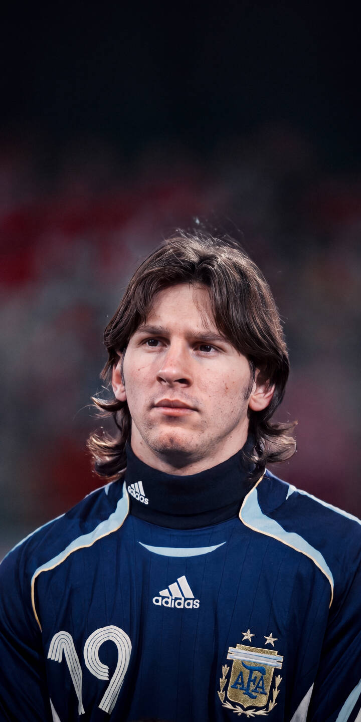 Lionel Messi's intense, youthful gaze captures a moment of focused determination in this stunning 4K wallpaper, featuring his iconic number 19 Argentina jersey. This compelling wallpaper is perfectly optimized for iPhone, bringing a piece of football history to your screen. | football athlete iphone messi soccer wallpaper lionel messi mobile 4k wallpaper hd wallpaper iconic argentina jersey Lionel Messi's intense, youthful gaze captures a moment of focused determination in this stunning 4K wallpaper, featuring his iconic number 19 Argentina jersey. This compelling wallpaper is perfectly optimized for iPhone, bringing a piece of football history to your screen.