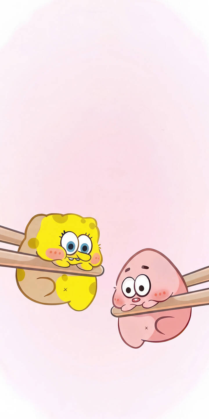 Chopsticks gently hold adorable, round versions of SpongeBob SquarePants and Patrick Star, their cheeks flushed, against a soft pink background in this charming 4K wallpaper. This delightful wallpaper is perfect for bringing a smile to your iPhone screen. | cartoon cute iphone wallpaper patrick star chibi mobile spongebob squarepants 4k wallpaper hd wallpaper nickelodeon sushi Chopsticks gently hold adorable, round versions of SpongeBob SquarePants and Patrick Star, their cheeks flushed, against a soft pink background in this charming 4K wallpaper. This delightful wallpaper is perfect for bringing a smile to your iPhone screen.