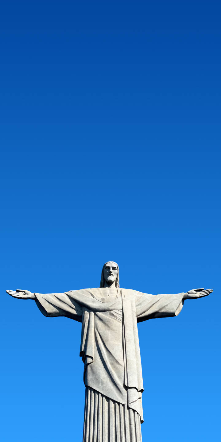 The majestic Christ the Redeemer statue stands tall with its arms outstretched against a breathtaking clear blue sky in this stunning 4K wallpaper. This iconic Brazil landmark makes for an inspiring wallpaper for your iPhone. | statue iphone wallpaper brazil jesus blue sky mobile 4k wallpaper hd wallpaper iconic christ the redeemer rio de janeiro The majestic Christ the Redeemer statue stands tall with its arms outstretched against a breathtaking clear blue sky in this stunning 4K wallpaper. This iconic Brazil landmark makes for an inspiring wallpaper for your iPhone.