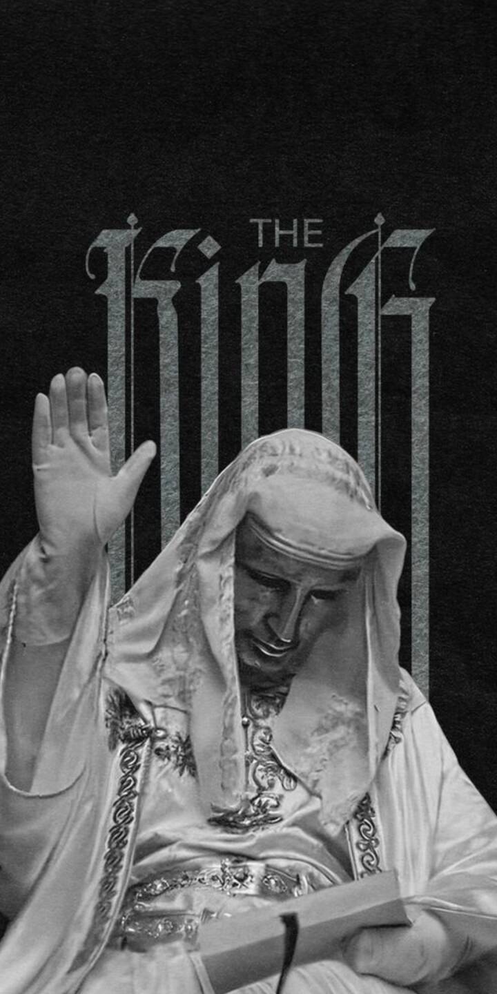 The enigmatic figure of The King, draped in ornate white robes with a metallic-looking mask and one hand raised solemnly, dominates this striking 4K wallpaper. This powerful monochromatic scene, with "THE KING" text emblazoned behind, makes an impactful wallpaper for iPhone users. | art The enigmatic figure of The King, draped in ornate white robes with a metallic-looking mask and one hand raised solemnly, dominates this striking 4K wallpaper. This powerful monochromatic scene, with "THE KING" text emblazoned behind, makes an impactful wallpaper for iPhone users.