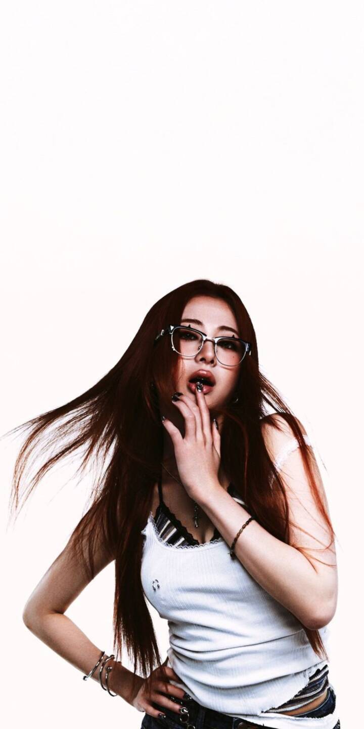 Stylish star-studded glasses frame this model's alluring gaze, as she strikes an edgy pose with her hand near her lips in this vibrant 4K wallpaper — an essential aesthetic wallpaper for iPhone users. | artist Stylish star-studded glasses frame this model's alluring gaze, as she strikes an edgy pose with her hand near her lips in this vibrant 4K wallpaper — an essential aesthetic wallpaper for iPhone users.