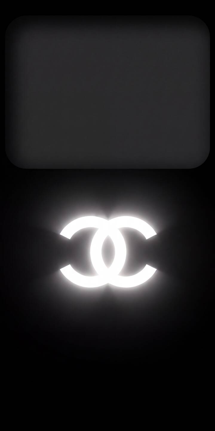 The iconic glowing Chanel CC logo radiates pure white luminescence against a minimalist dark background in this premium 4K wallpaper. This elegant wallpaper is perfect for enhancing your iPhone's lock screen with a touch of luxury. | aesthetic dark glow iphone luxury minimalist wallpaper mobile 4k wallpaper hd wallpaper chanel cc logo The iconic glowing Chanel CC logo radiates pure white luminescence against a minimalist dark background in this premium 4K wallpaper. This elegant wallpaper is perfect for enhancing your iPhone's lock screen with a touch of luxury.
