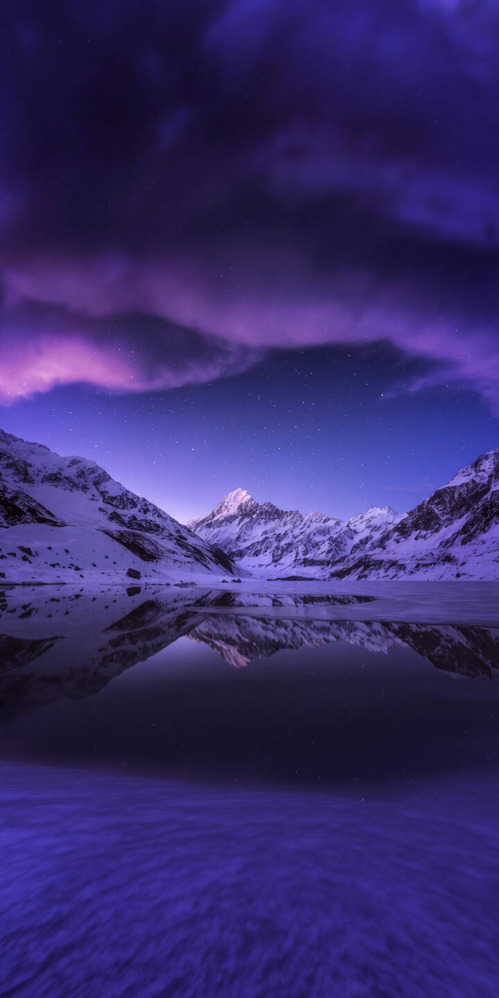 Dramatic purple clouds drift across a star-flecked sky above snow-capped mountains, their peaks beautifully mirrored in a glassy lake, making this a stunning 4K wallpaper for your iPhone. This tranquil landscape serves as an awe-inspiring mobile wallpaper. | landscape night purple lake snow iphone mountains wallpaper starry mobile 4k wallpaper hd wallpaper Dramatic purple clouds drift across a star-flecked sky above snow-capped mountains, their peaks beautifully mirrored in a glassy lake, making this a stunning 4K wallpaper for your iPhone. This tranquil landscape serves as an awe-inspiring mobile wallpaper.