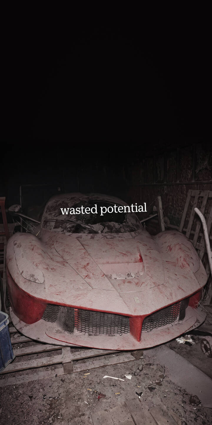 A thick coat of reddish dust covers an abandoned Ferrari sports car, its red front bumper barely visible in this dramatic 4K wallpaper — an eerie find for any iPhone enthusiast seeking a unique car wallpaper. | iphone ferrari supercar wallpaper mobile red car moody 4k wallpaper hd wallpaper gritty abandoned car dusty car A thick coat of reddish dust covers an abandoned Ferrari sports car, its red front bumper barely visible in this dramatic 4K wallpaper — an eerie find for any iPhone enthusiast seeking a unique car wallpaper.